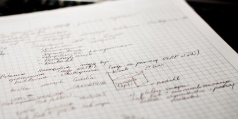 Handwritten notes and a flowchart on a piece of graph paper including outbound links.