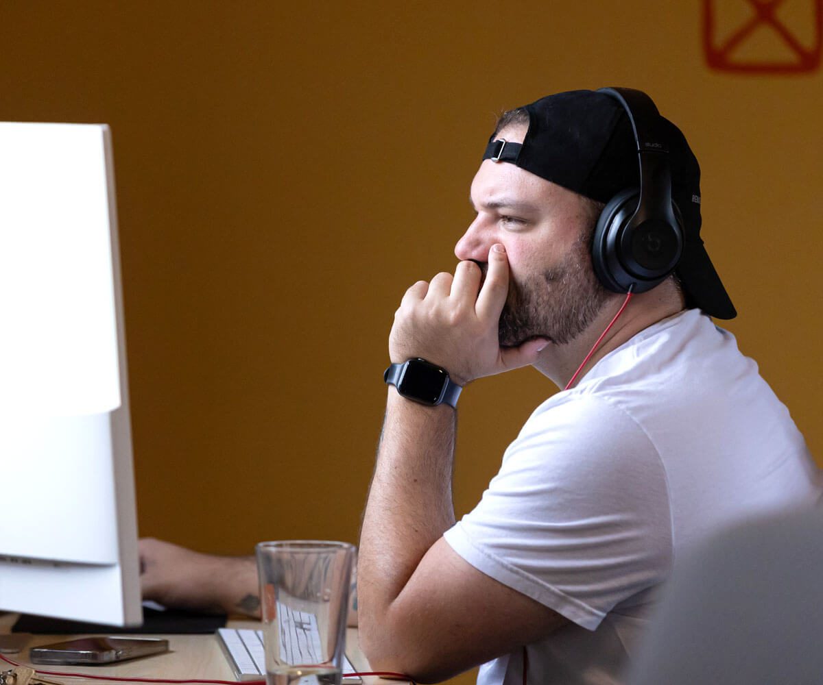 Orbiteer, Kyle, focused at his desk