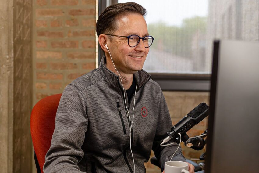 Andy Crestodina working at his desk, smiling