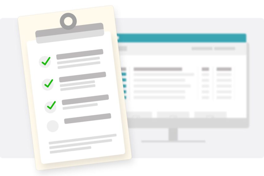 A clipboard with a checklist in front of a computer screen.